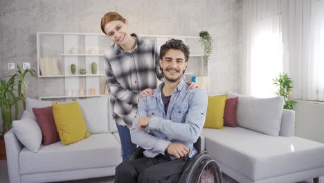 The-disabled-man-in-a-wheelchair-and-his-girlfriend-who-cheers-him-up.